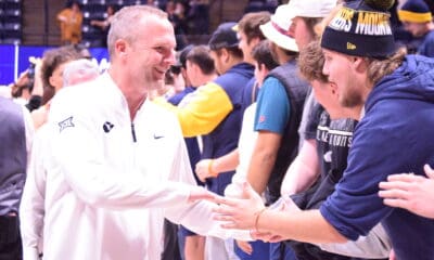 WVU Basketball HC Darian DeVries with WVU fans