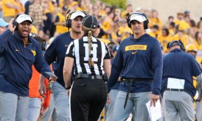 WVU HC Neal Brown and coaches Victor Cabral and ShaDon Brown