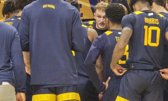 WVU Basketball Huddle led by Tucker DeVries