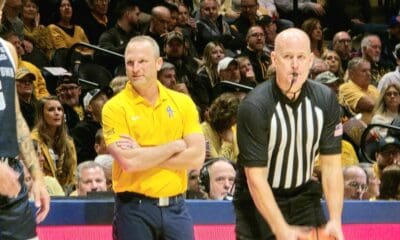 WVU Basketball HC Darian DeVries and ref