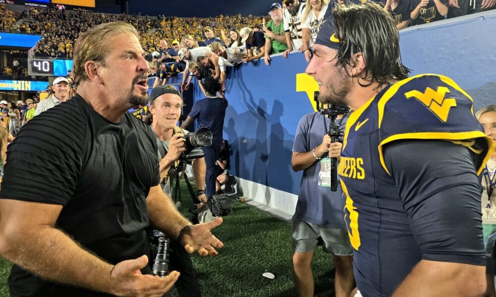 WVU Football QB Nicco Marchiol Celebrate Backyard Brawl Win with his father.