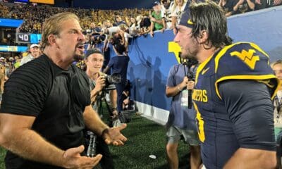 WVU Football QB Nicco Marchiol Celebrate Backyard Brawl Win with his father.