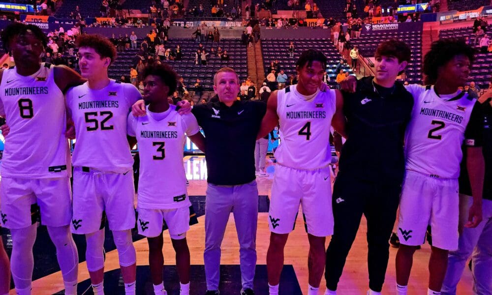 WVU Basketball Ross Hodge with players Country Roads