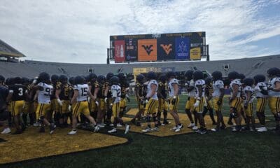WVU Football shake hands after spring game