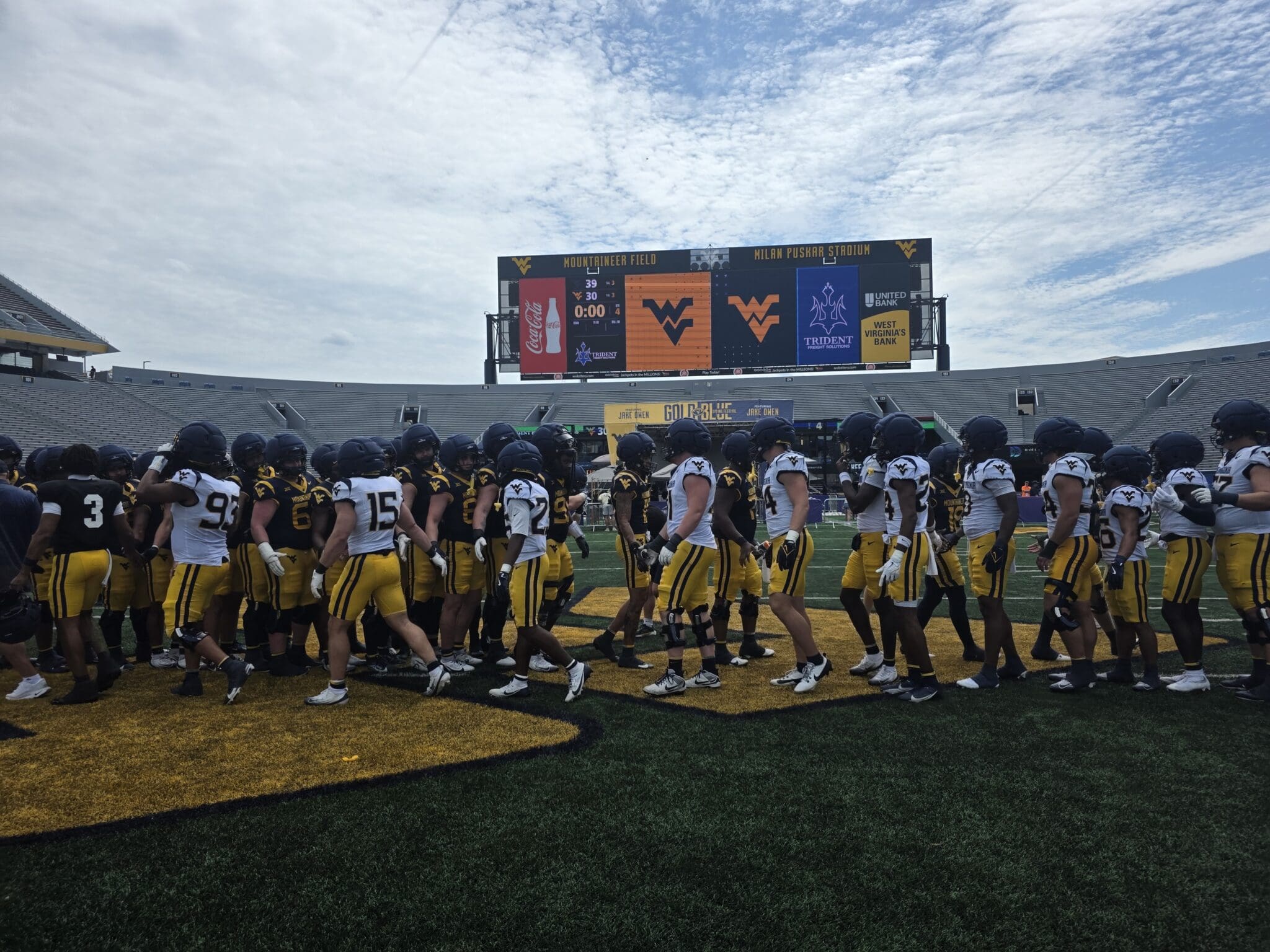 WVU Football shake hands after spring game