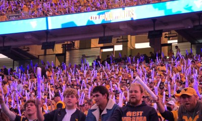 WVU Football crowd at night game stock