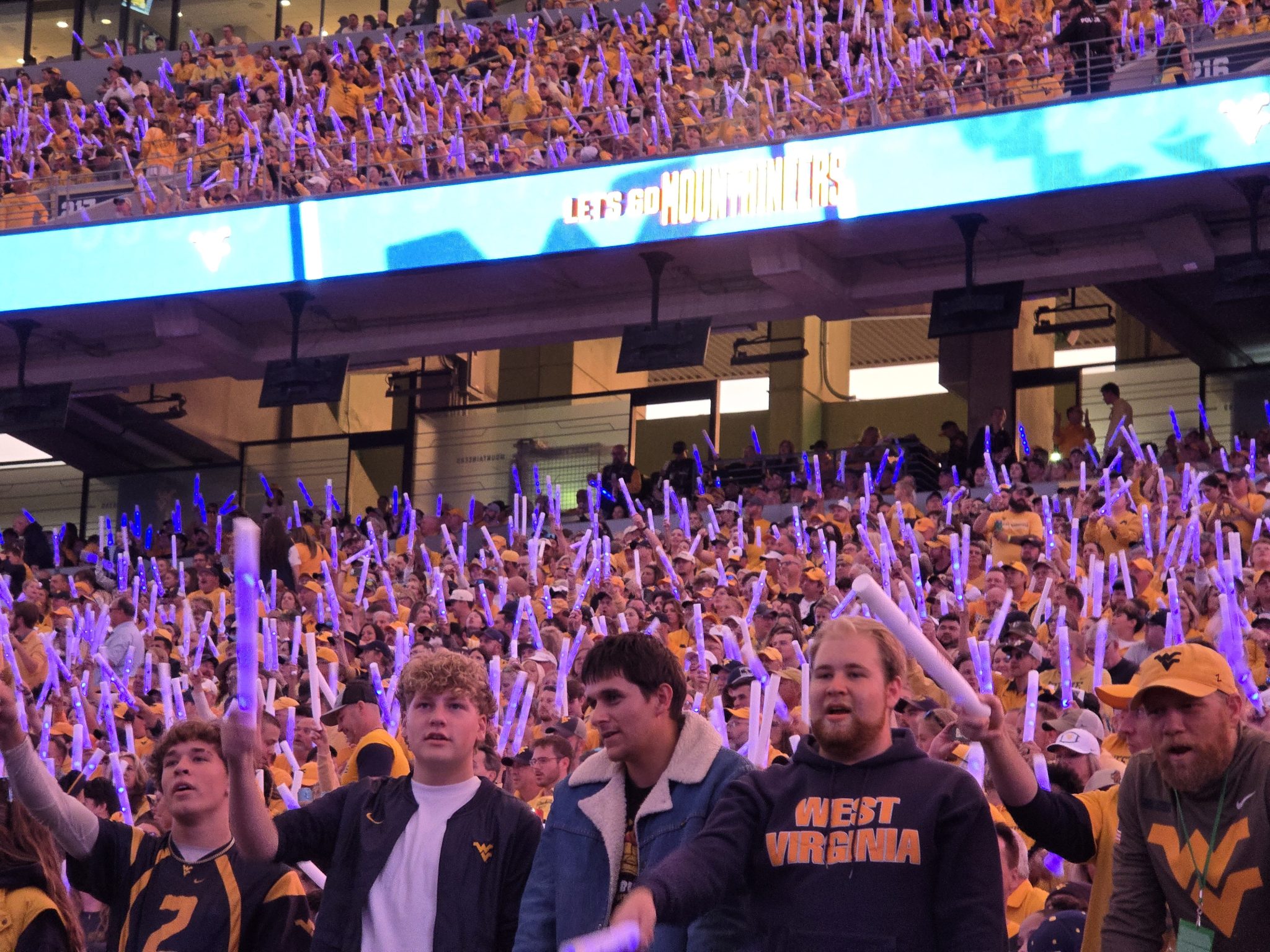 WVU Football crowd at night game stock