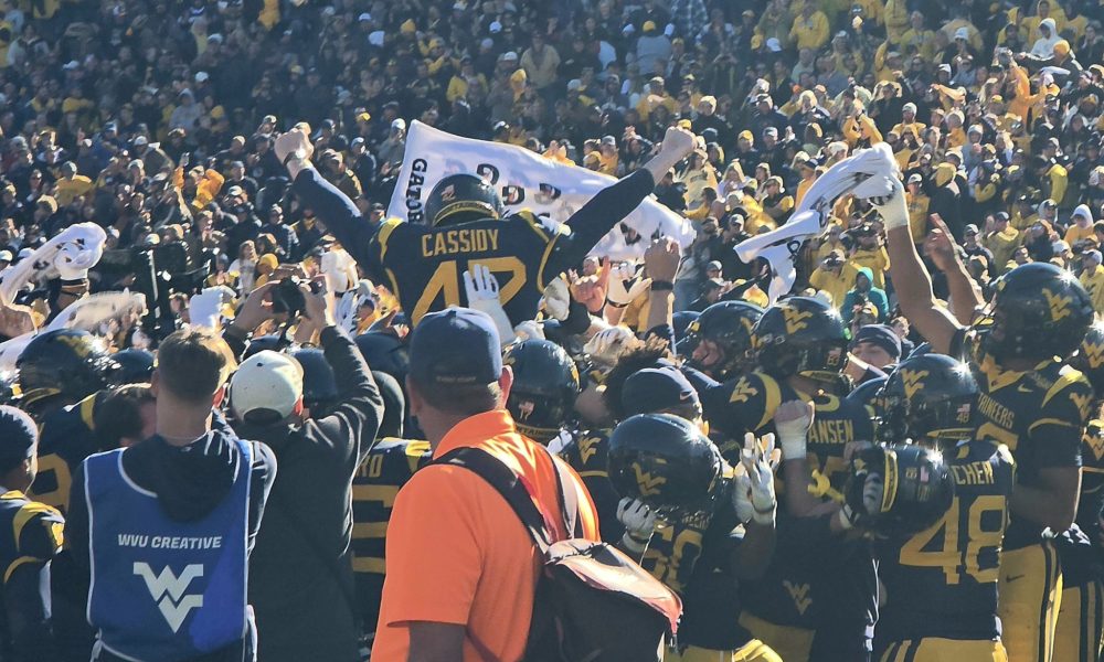 WVU Football kicker Jack Cassidy being carried off the field