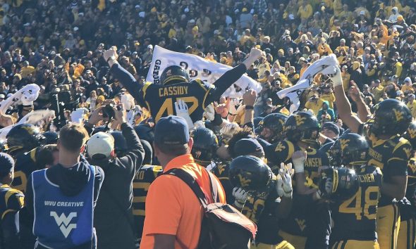 WVU Football kicker Jack Cassidy being carried off the field