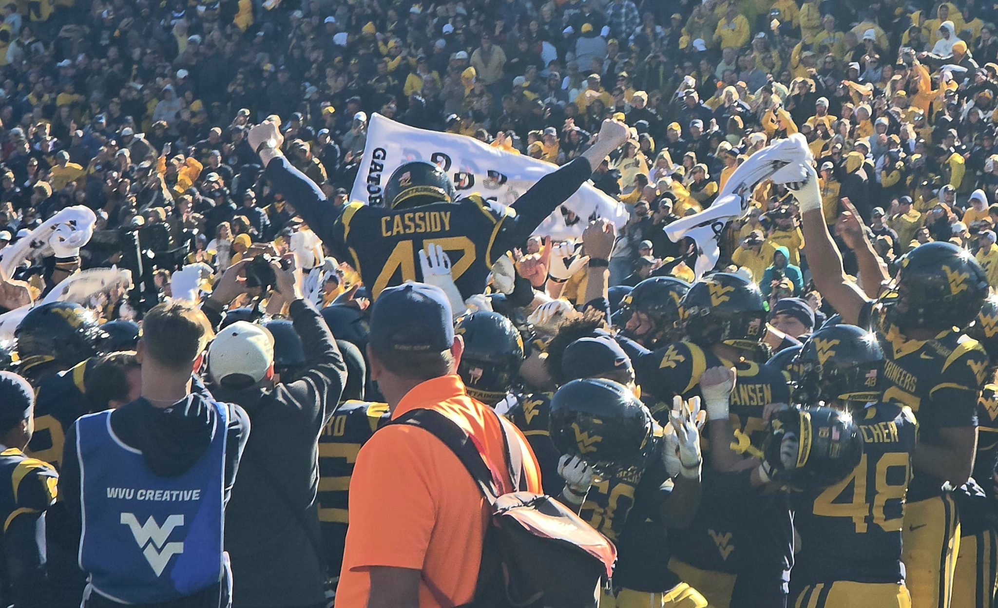 WVU Football kicker Jack Cassidy being carried off the field