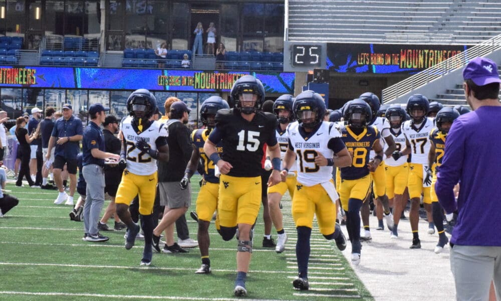 WVU Football QB Scotty Fox running on field for spring scrimmage