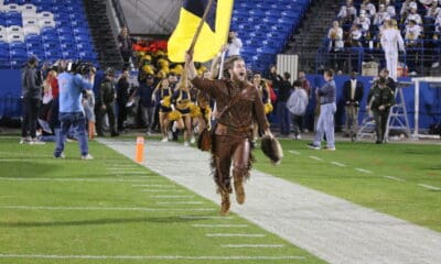 WVU Mascot with flag at Frisco Bowl stock