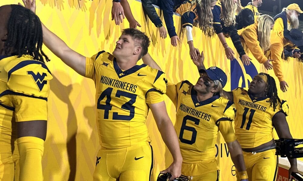 WVU fans and Garrett Greene after a win