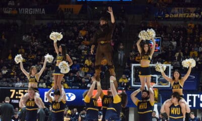 WVU Basketball Mountaineer Mascot and cheerleaders STOCK