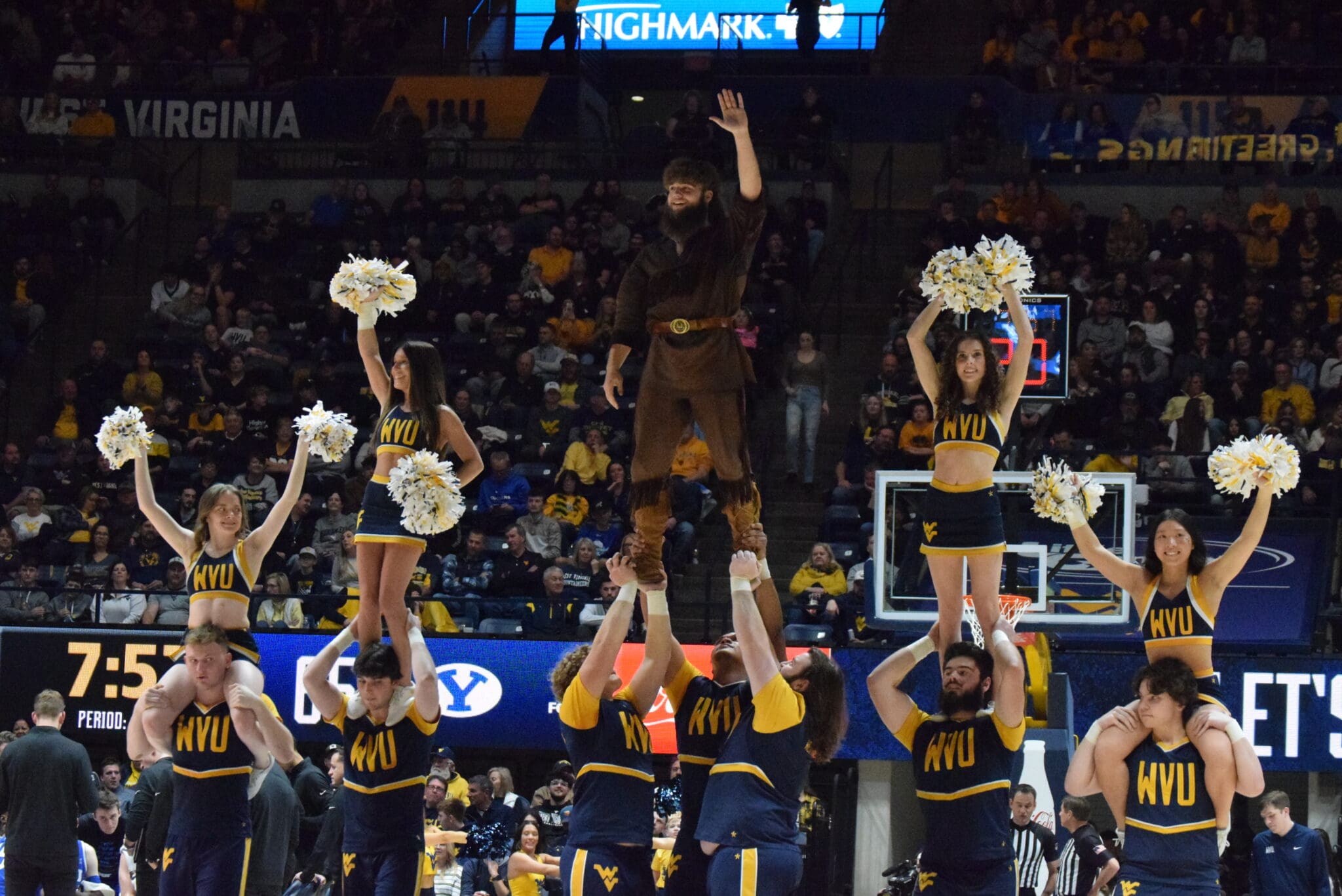 WVU Basketball Mountaineer Mascot and cheerleaders STOCK