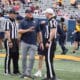 WVU Football HC Rich Rodriguez with refs during Spring Showcase