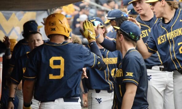 WVU Baseball Grant Hussey high fives teammates