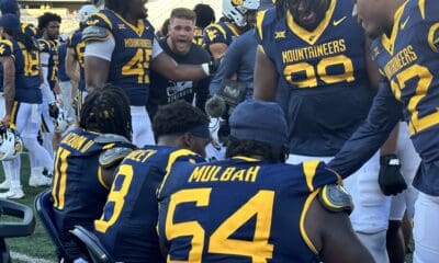 WVU Football Defense Celebrates Stop on the Bench