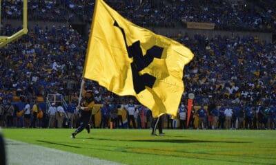 WVU flag in end zone at Pitt stock