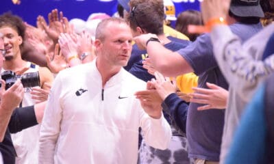 WVU Basketball HC Darian DeVries with WVU fans