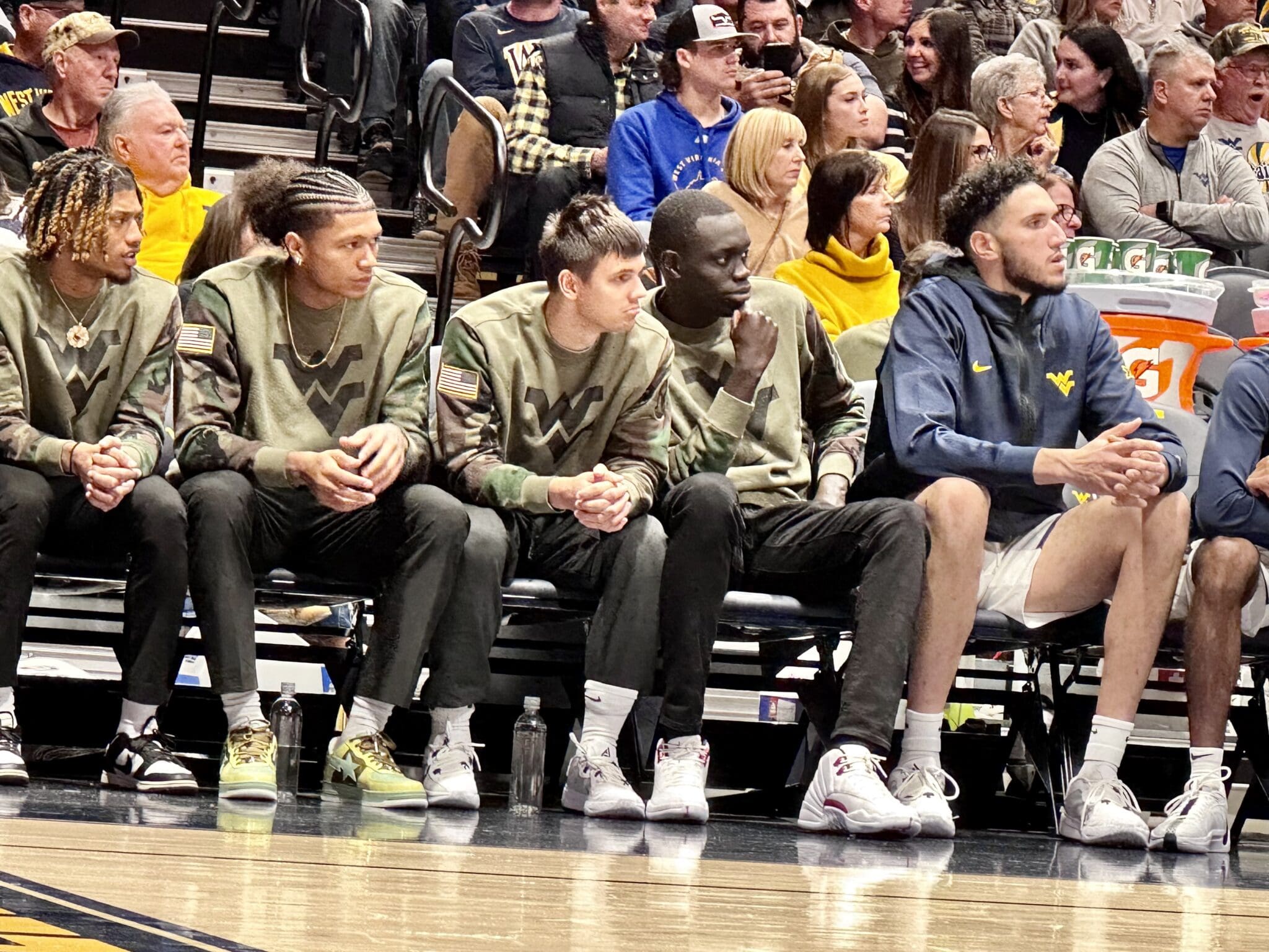 WVU Basketball team on bench