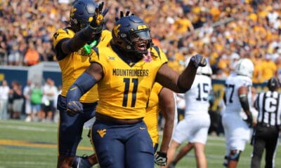 WVU Football TJ Jackson and Aubrey Burks celebrate a turnover