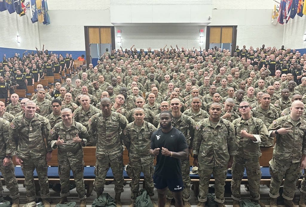 WVU Football safety Anthony Wilson with Army soldiers