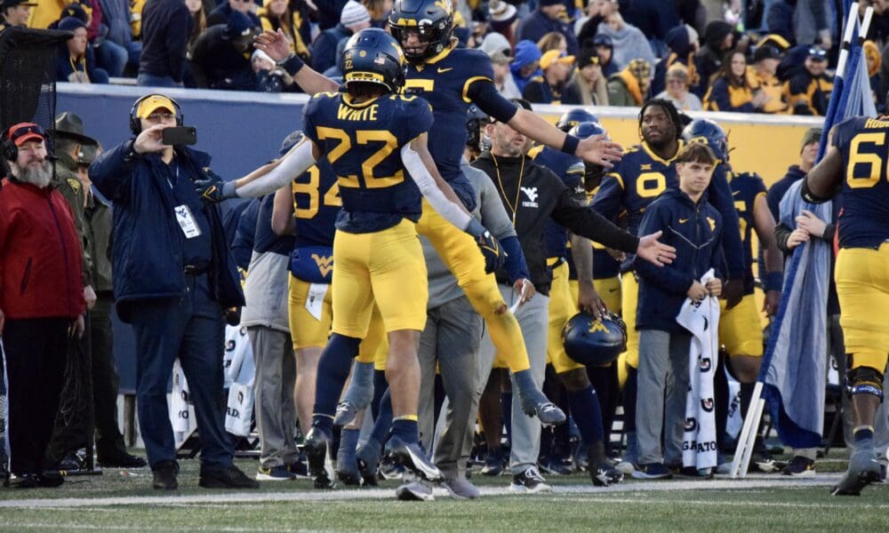 WVU Football Jahiem White and Garrett Greene celebrate