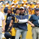 WVU Football head coach Neal Brown and OLB coach Victor Cabral
