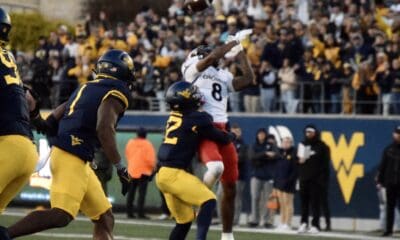 WVU Football Anthony Wilson making a tackle against Cincinnati