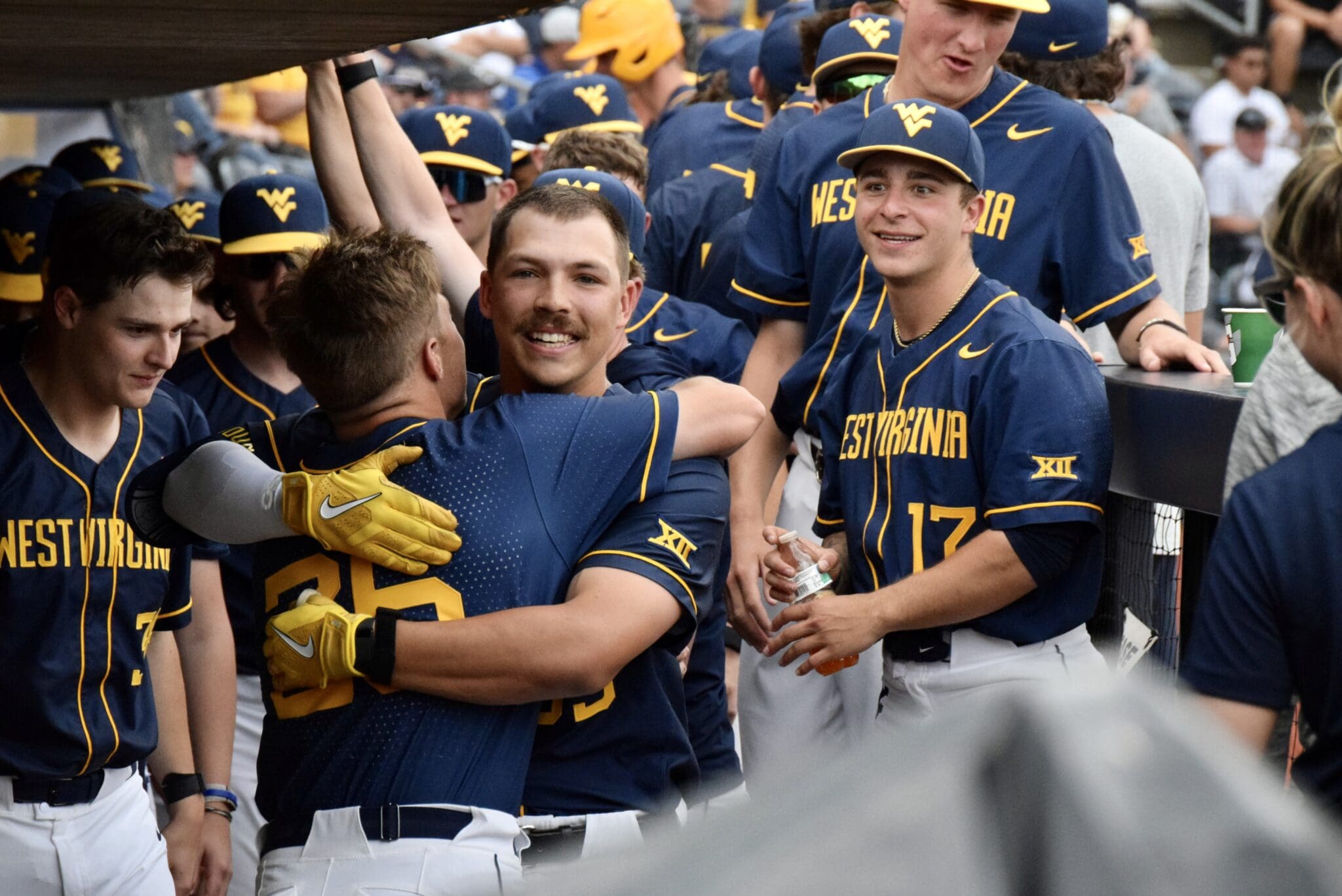 WVU Baseball celebrates Kyle West home run in the dugout