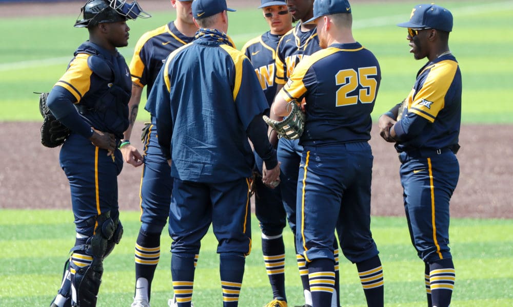 WVU baseball team on mound with Carson Reed