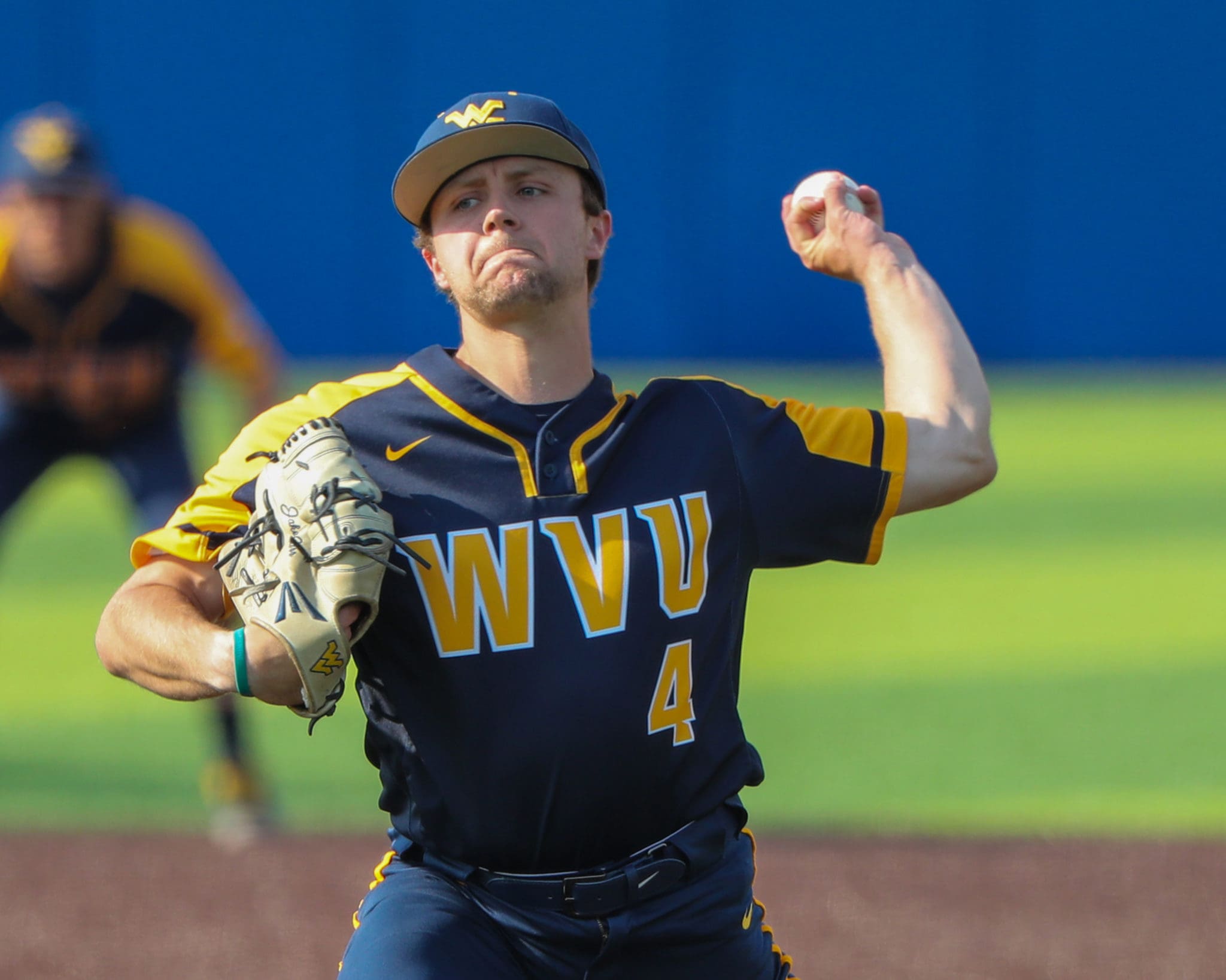 WVU pitcher Jake Carr winds up for a throw.