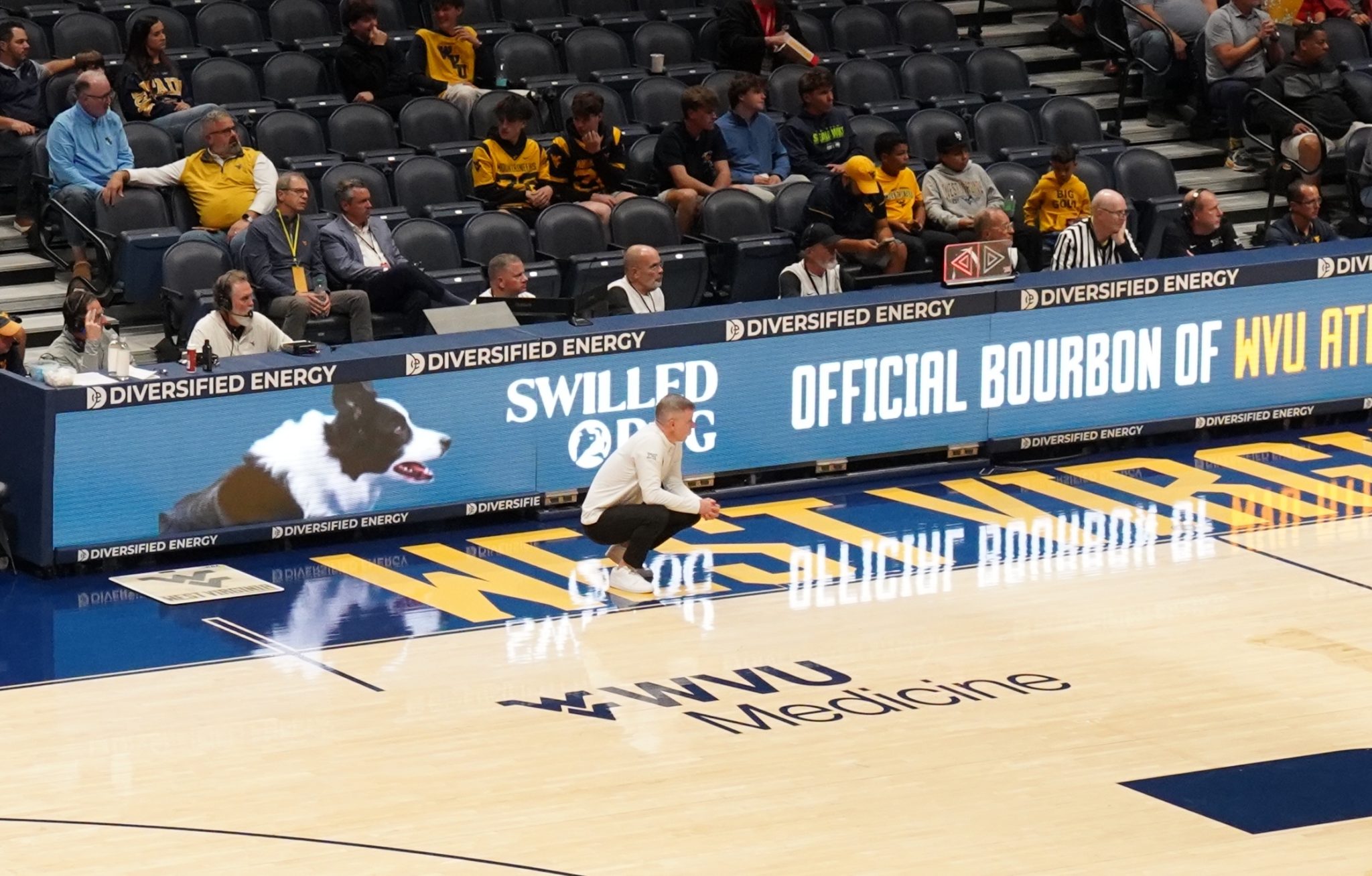 WVU Basketball HC Ross Hodge on court