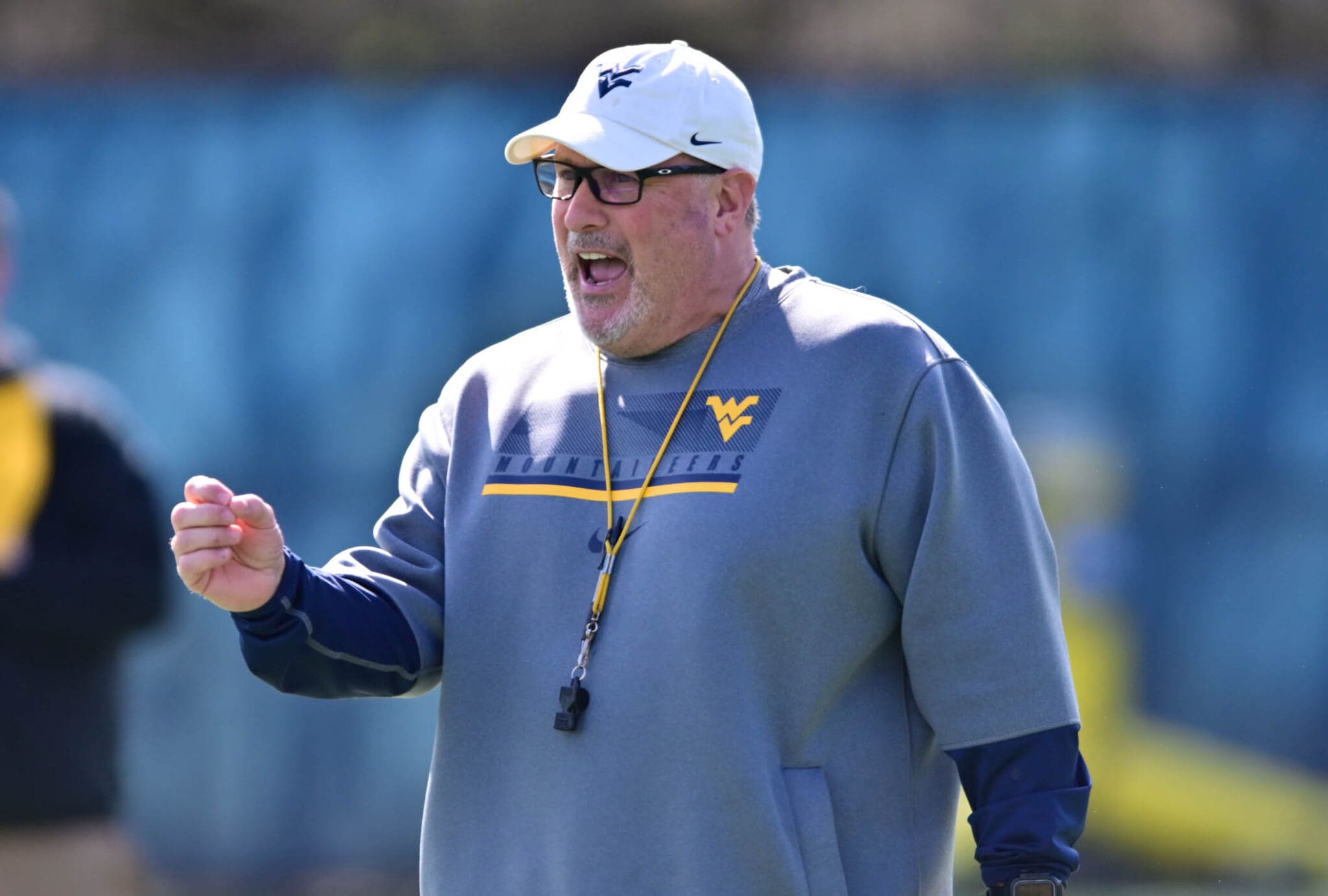 WVU Football OL Coach Matt Moore coaching WVU offensive line at spring practice