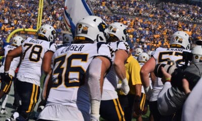 WVU Football team running out on field for Backyard Brawl