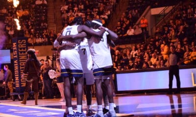 WVU Basketball huddle stock