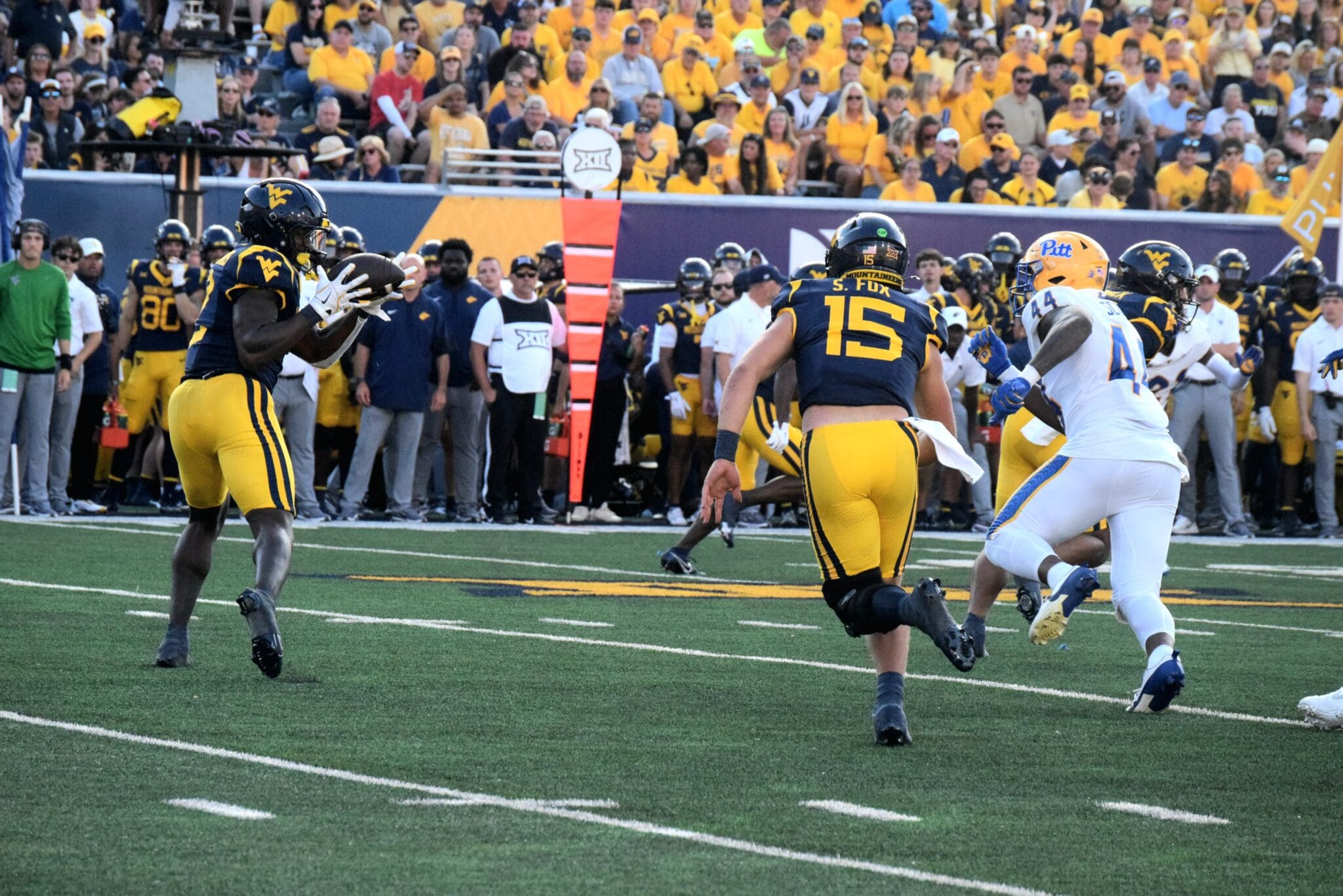 WVU Football QB Scotty Fox Jr. tosses the ball to RB Tye Edwards