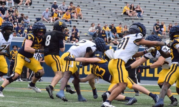 WVU Football Nicco Marchiol tackled at Spring Showcase