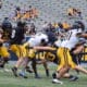 WVU Football Nicco Marchiol tackled at Spring Showcase