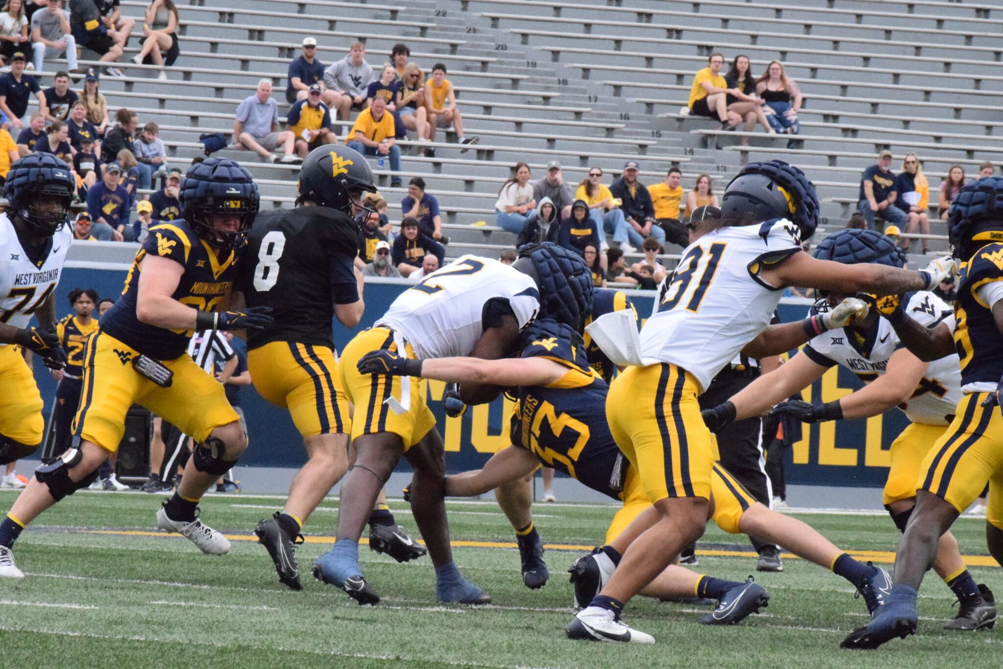 WVU Football Nicco Marchiol tackled at Spring Showcase