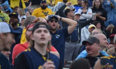 WVU Football fan hands on head during Utah game