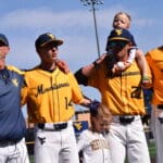 WVU Baseball Randy Mazey, Steve Sabins and Grant Hussey celebrating after win