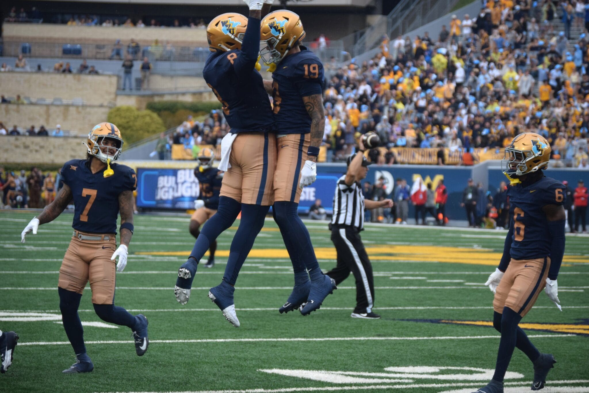 WVU Football CB Nick Taylor (19) celebrates interception versus Utah