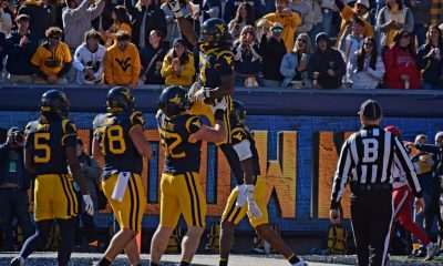 WVU Football OL Nick Krahe lifts Cam Cook