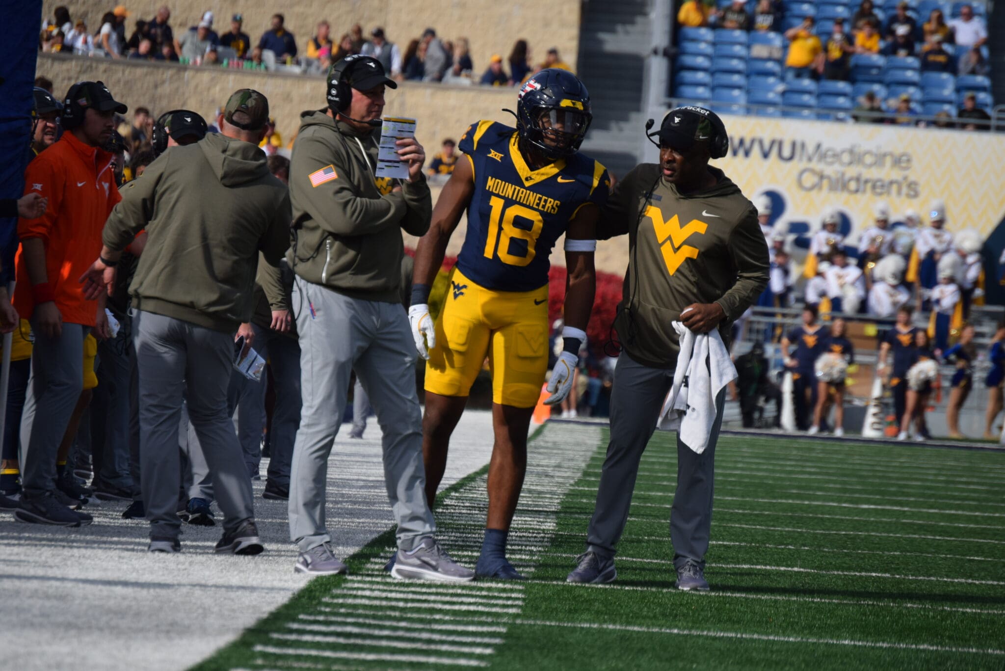 WVU Football HC Rich Rodriguez, Curtis Jones and Larry Porter