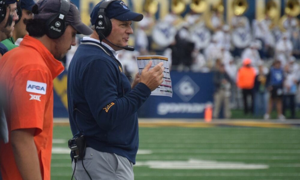 WVU Football HC Rich Rodriguez on field during game