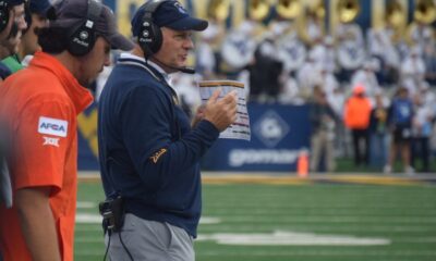 WVU Football HC Rich Rodriguez on field during game