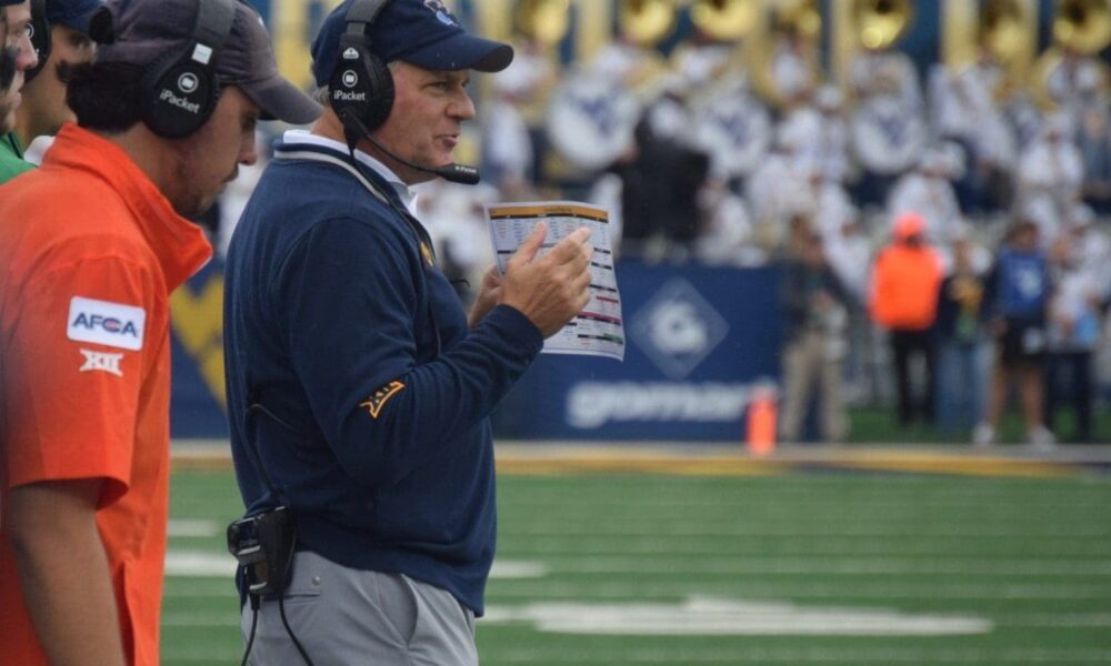 WVU Football HC Rich Rodriguez on field during game