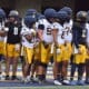WVU Football Jaylen Henderson and Nicco Marchiol with team at spring showcase